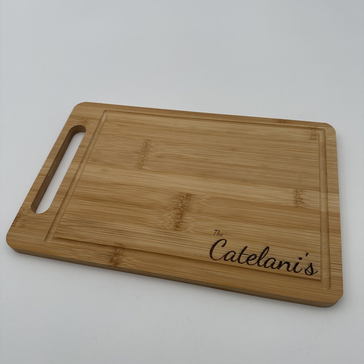 Bamboo last name cutting board view 2