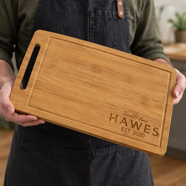 A personalized bamboo board with the family name, sitting out on a counter