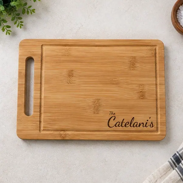 A bamboo board engraved with a client's family name in script