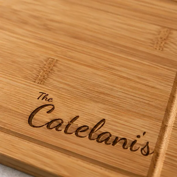 A script-style bamboo board, warmer and less formal than block capitals