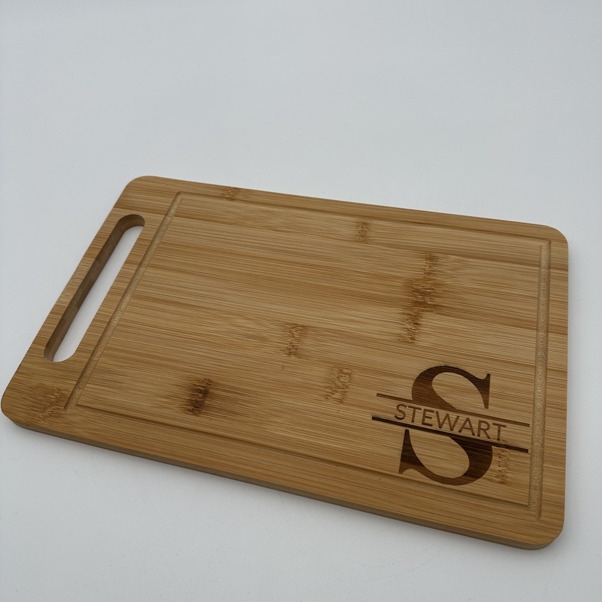 Split monogram bamboo cutting board view 2